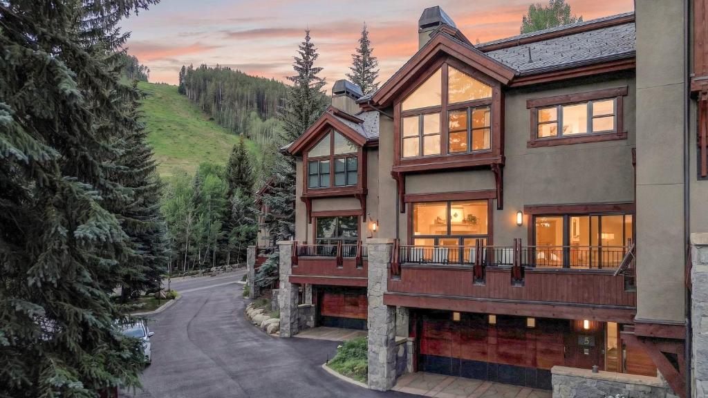 a house in the mountains with a driveway at Chalet Premio in Beaver Creek