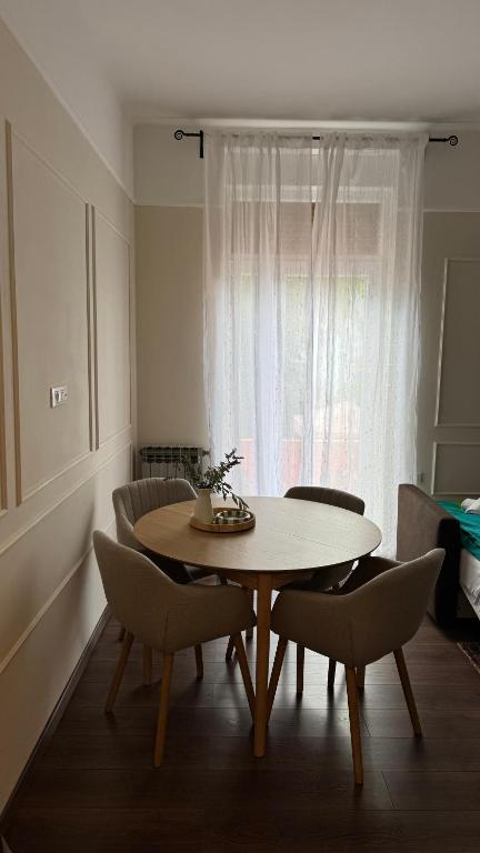 a dining room with a table and chairs and a window at Little Paradise - charming apartment in Labin