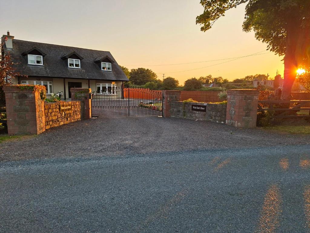 a driveway in front of a house with a gate at White Quarry Hse Quarry Road in Navan