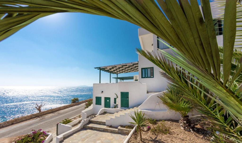 a house with a view of the ocean at Pahivouni Studios & Suites in Donoussa