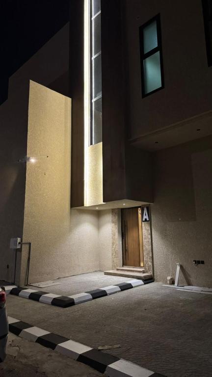 an empty building with a door and a window at SORANO Apartments in Hail