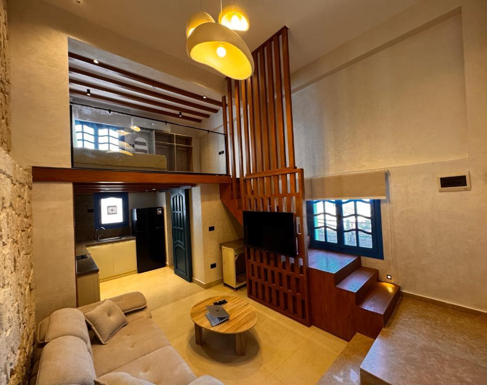 a living room with a couch and a table at Naama Lofts in Sharm El Sheikh