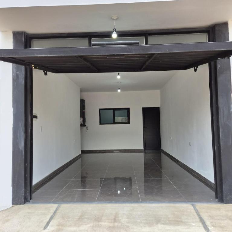 a large room with white walls and a ceiling at Departamento LUNA DE BELEN in Belén