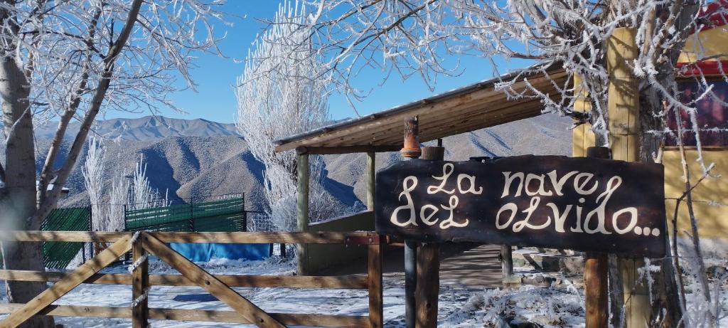 a sign in front of a ski lodge in the snow at La Nave del Olvido- Cabaña Potrerillos in Potrerillos
