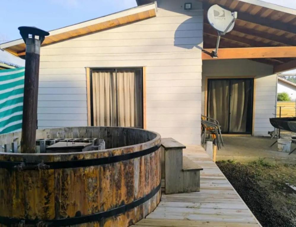 a wooden deck in front of a house at Hospedaje Francesco in Puerto Montt