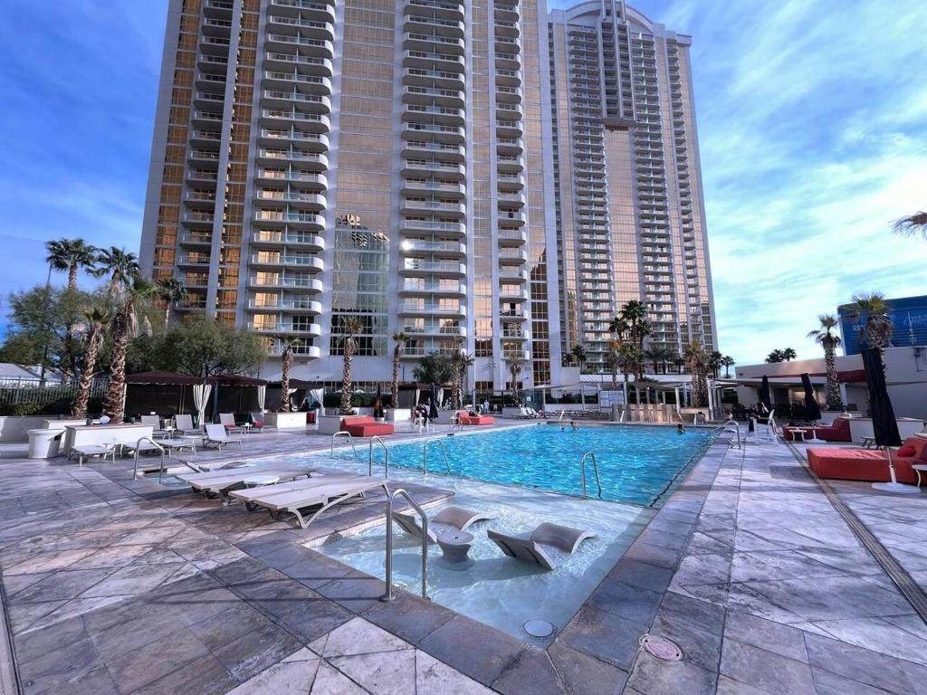 a swimming pool in a city with tall buildings at MGM Signature No Resort Fees, Jacuzzi & Pools in Las Vegas