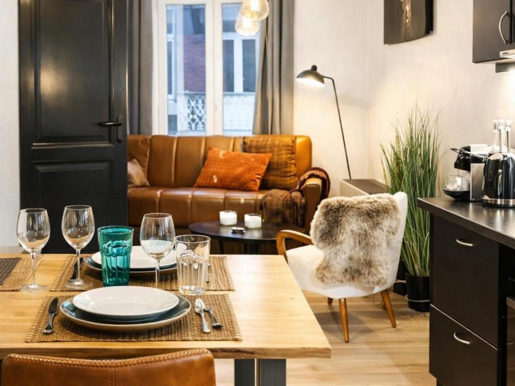 a living room with a table and a couch at The Jade Elegant apartment with balcony in Spa