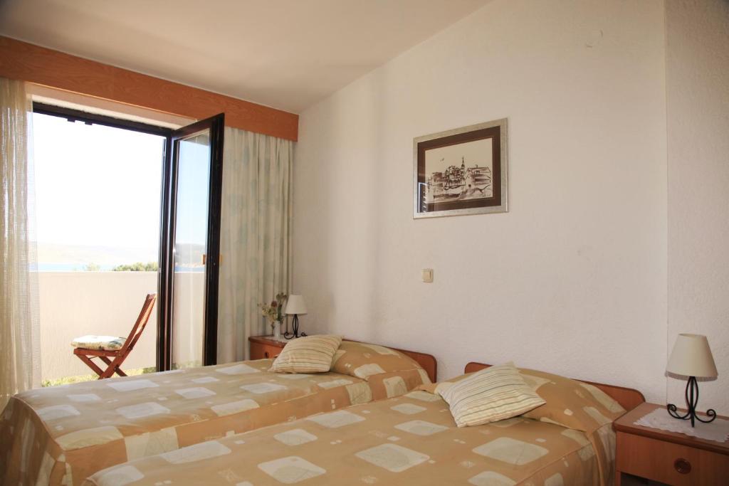 Postel nebo postele na pokoji v ubytování Hotel Rajna
