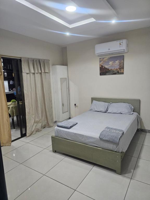 a bedroom with a bed in a room at Newly Opened Mini Suite in Manta
