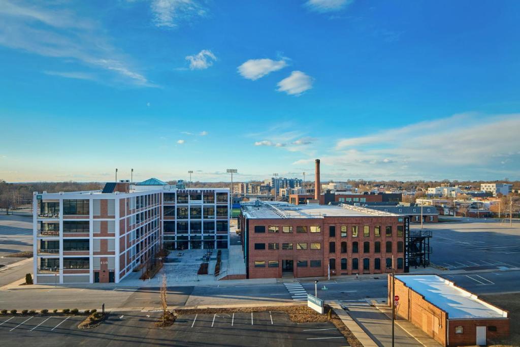 an aerial view of a city with a building at SpringHill Suites by Marriott High Point Downtown in High Point