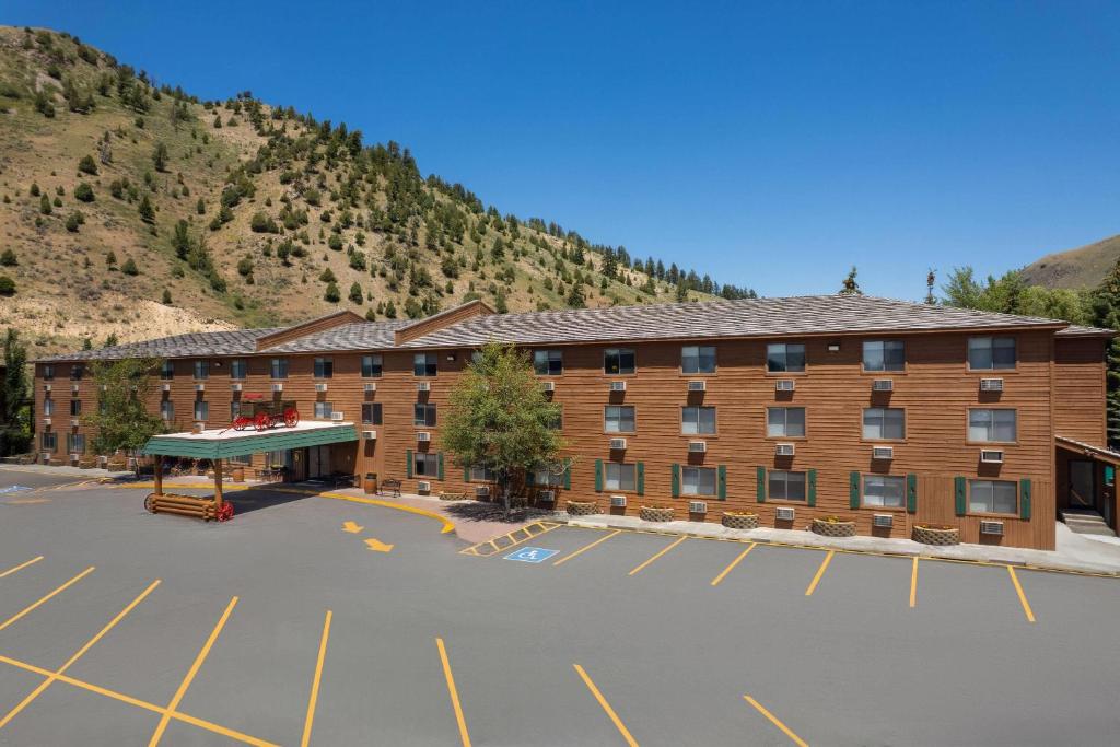 an empty parking lot in front of a hotel at Super 8 by Wyndham Jackson Hole in Jackson