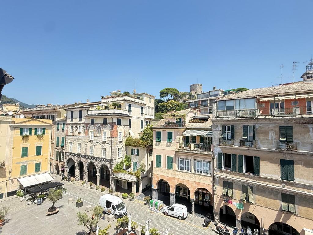 a group of buildings in a city with cars at Happy Haven al mare in Riviera in Chiavari