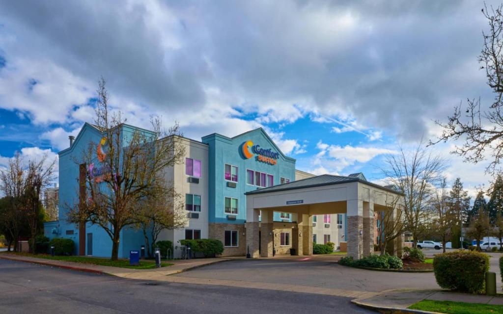a rendering of a hotel with a building at Comfort Suites Springfield-Eugene in Springfield