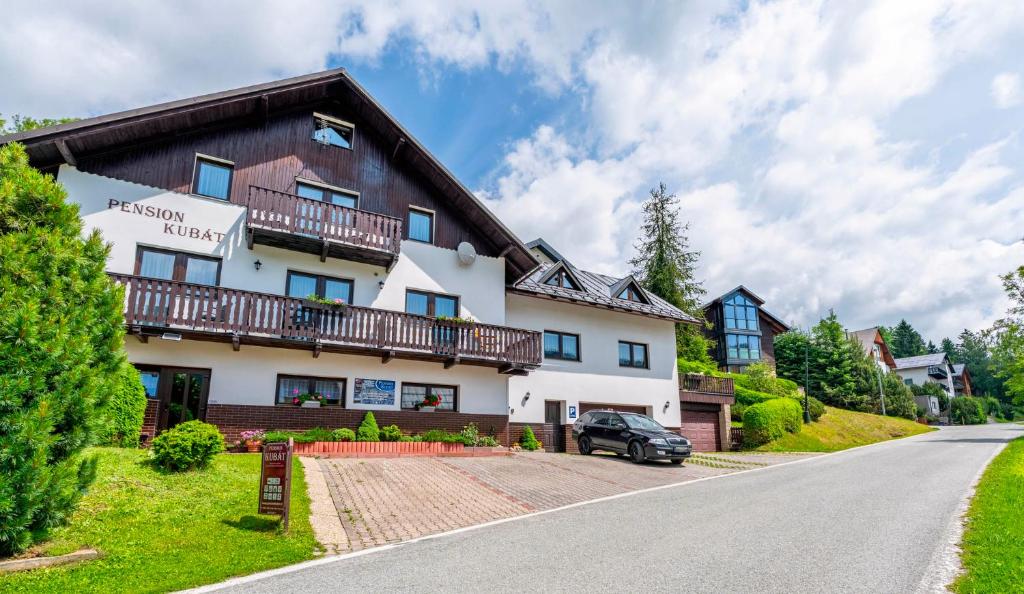 a view of the hotel from the road at Pension Kubát in Špindlerův Mlýn