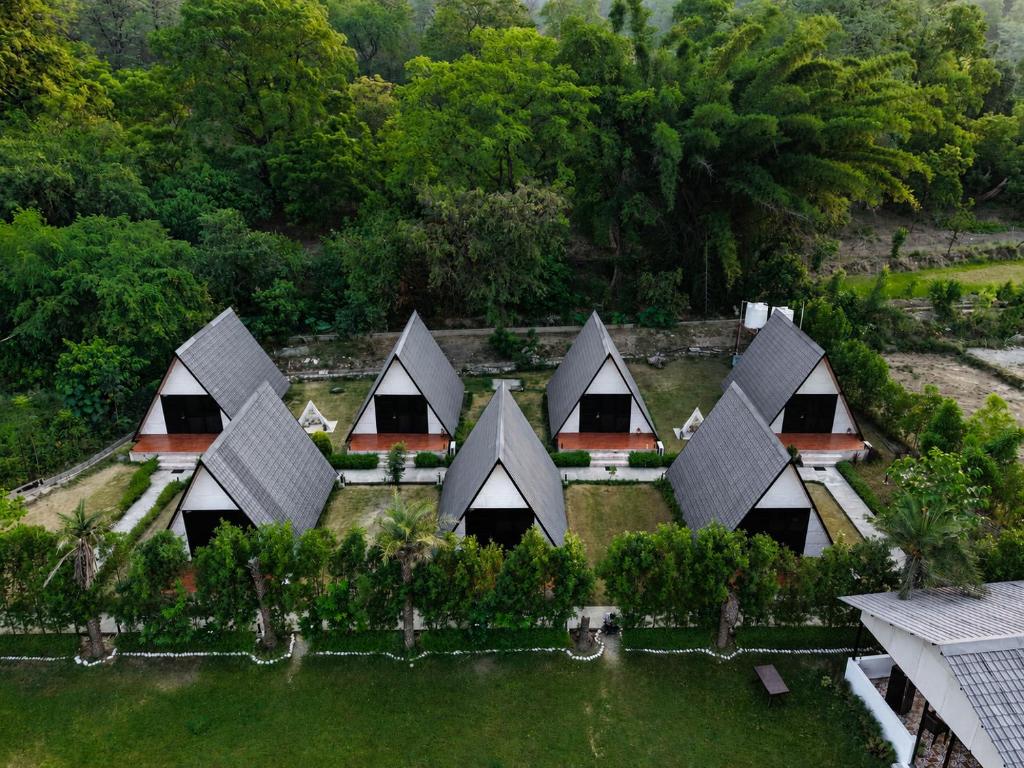 an aerial view of a group of houses at The Arks Baagh Villas in Rāmnagar