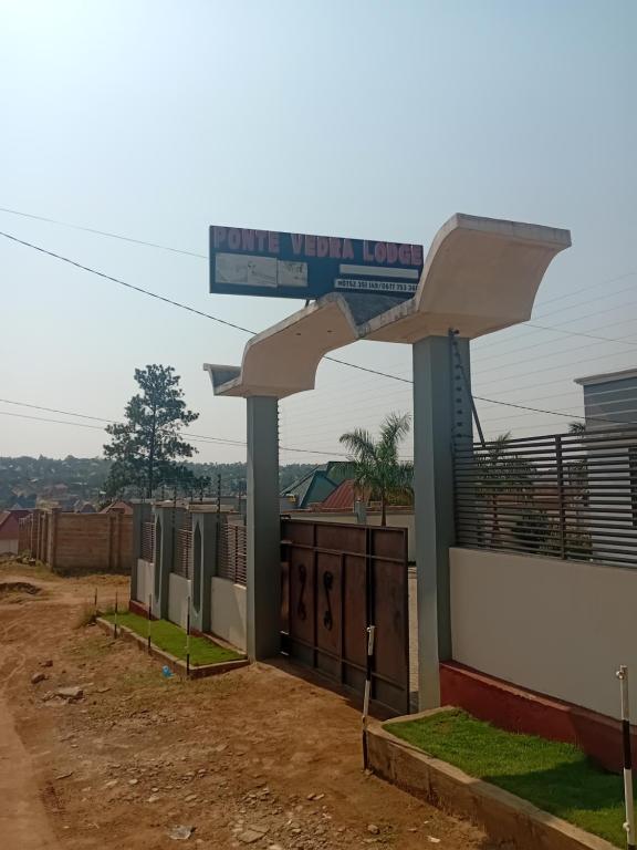 a gas station with a sign on top of it at Ponte Vedra Lodge in Mwanza