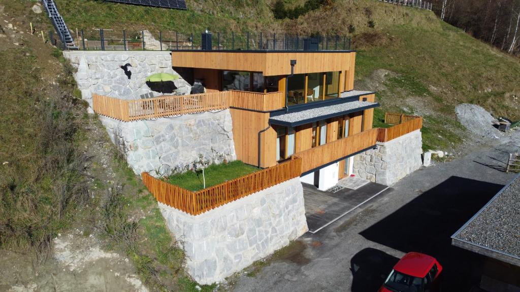 a house built on top of a hill at Alpen-Chalet mit privater Sauna und Gletscher Panorama in Neukirchen am Großvenediger