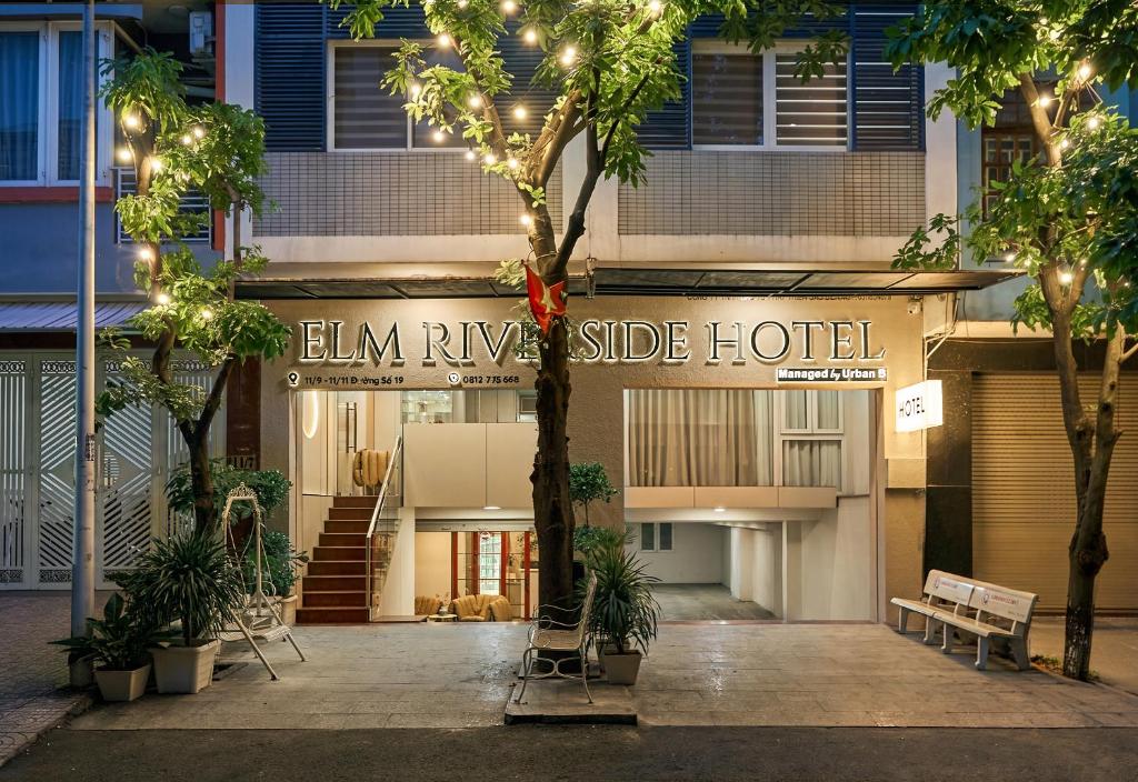 a building with a sign that reads elm rise side hotel at Elm Riverside Hotel by Urban B in Ho Chi Minh City