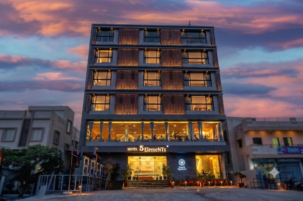 a tall building with a lot of windows at Hotel 5 Elements By Fidato Hotels in Akalkot