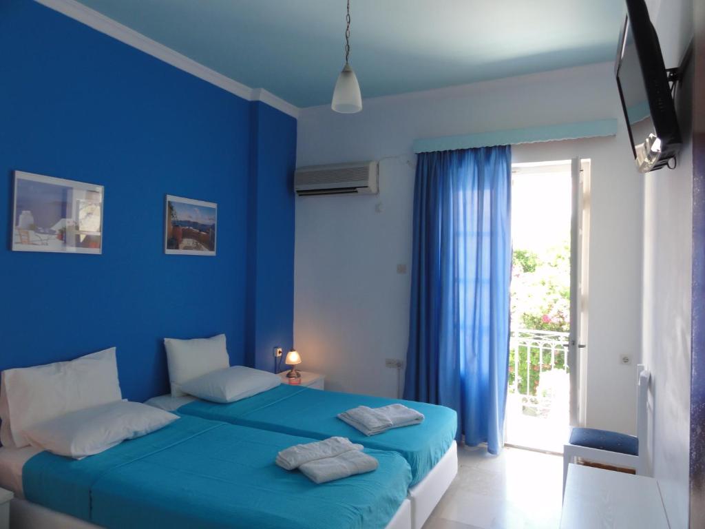 Postel nebo postele na pokoji v ubytování Botsis Guest House