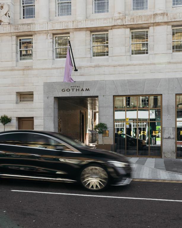 a car driving in front of a building at Hotel Gotham Newcastle in Newcastle upon Tyne