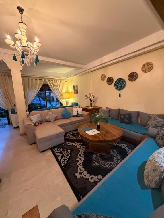 a living room with a couch and a table at Dar Fayz in Marrakesh