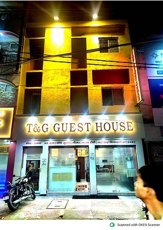 a tgc guest house with a motorcycle in front of it at T & G Guest House in Patna