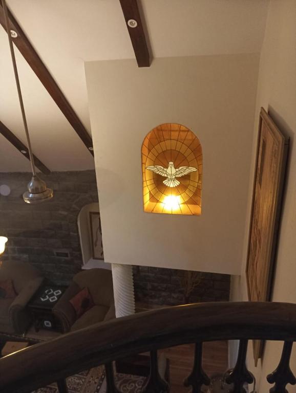 a room with a ceiling with a butterfly on the wall at Charming Stone Cottage in erstwhile grape gardens in Secunderabad
