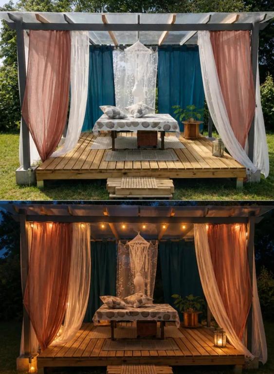 a bed on a wooden deck with curtains and lights at Les pieds dans l'eau Pergola in Fleurville
