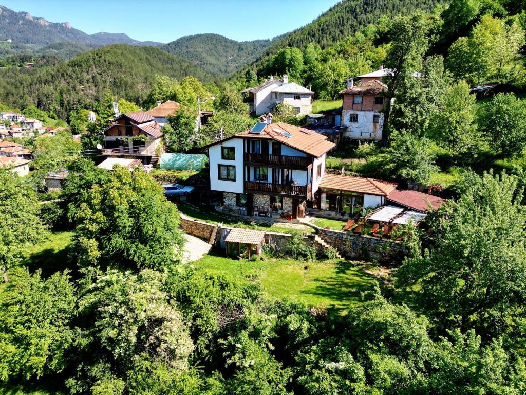 an aerial view of a village in the mountains at Guest House Opa in Smolyan