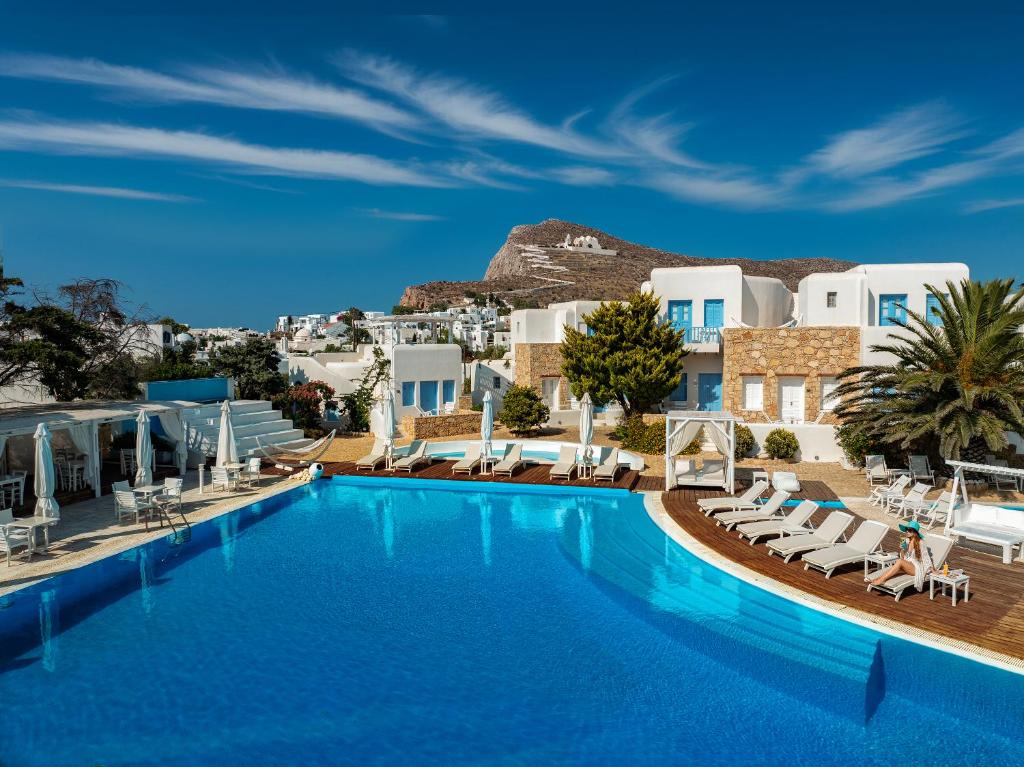 a view of a pool at a resort with white buildings at Chora Resort Hotel & Spa in Chora Folegandros