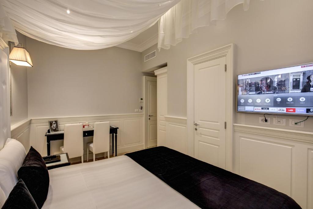 Postel nebo postele na pokoji v ubytování Hotel Tito