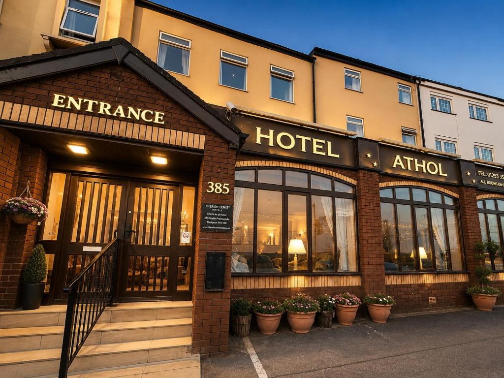 an entrance to a hotel with plants in front of it at Cherish Lewis Sea View Hotel in Blackpool
