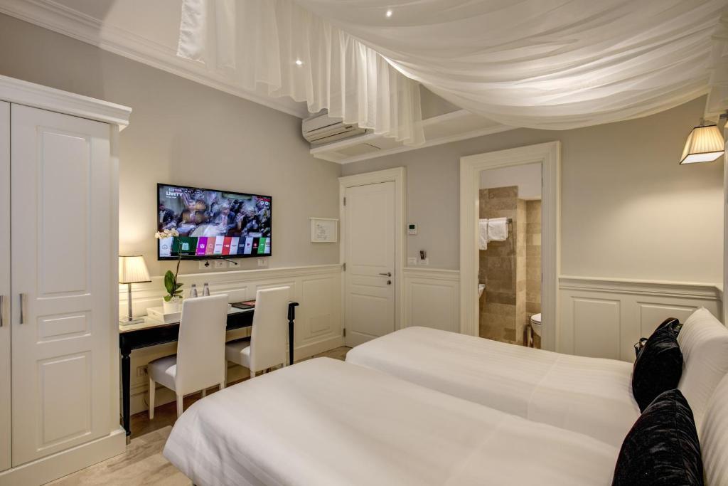 Postel nebo postele na pokoji v ubytování Hotel Tito