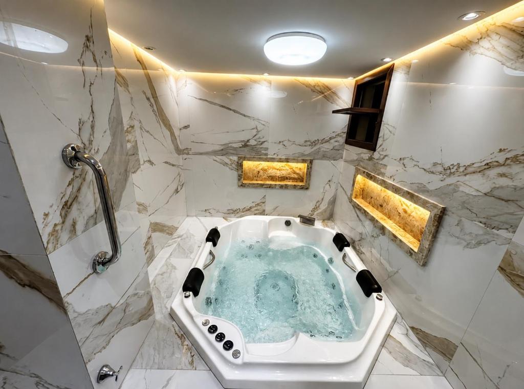a bathroom with a jacuzzi tub in the middle at Solar de Pipa Vip Confort - Spa Hidro Flat in Pipa