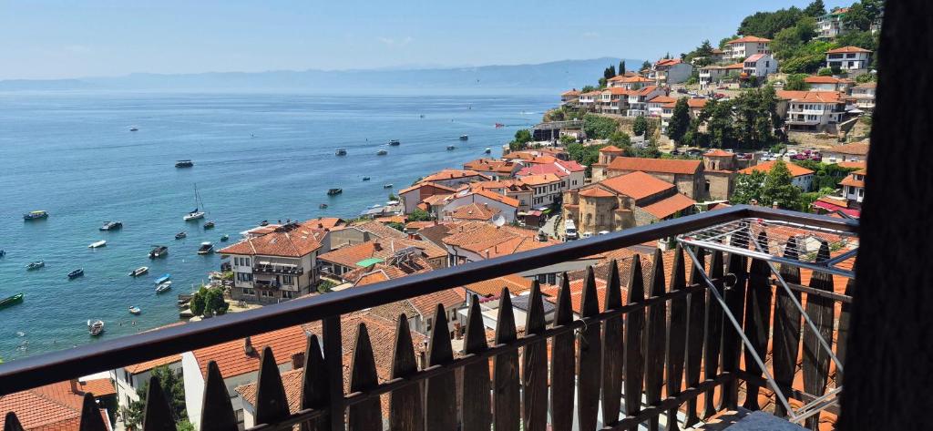 a view of a town with boats in the water at Villa Malezan in Ohrid