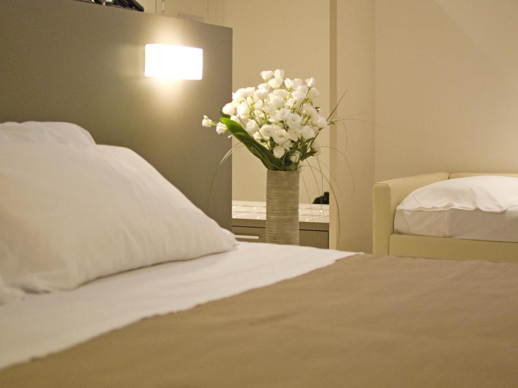 Postel nebo postele na pokoji v ubytování Hotel Cube