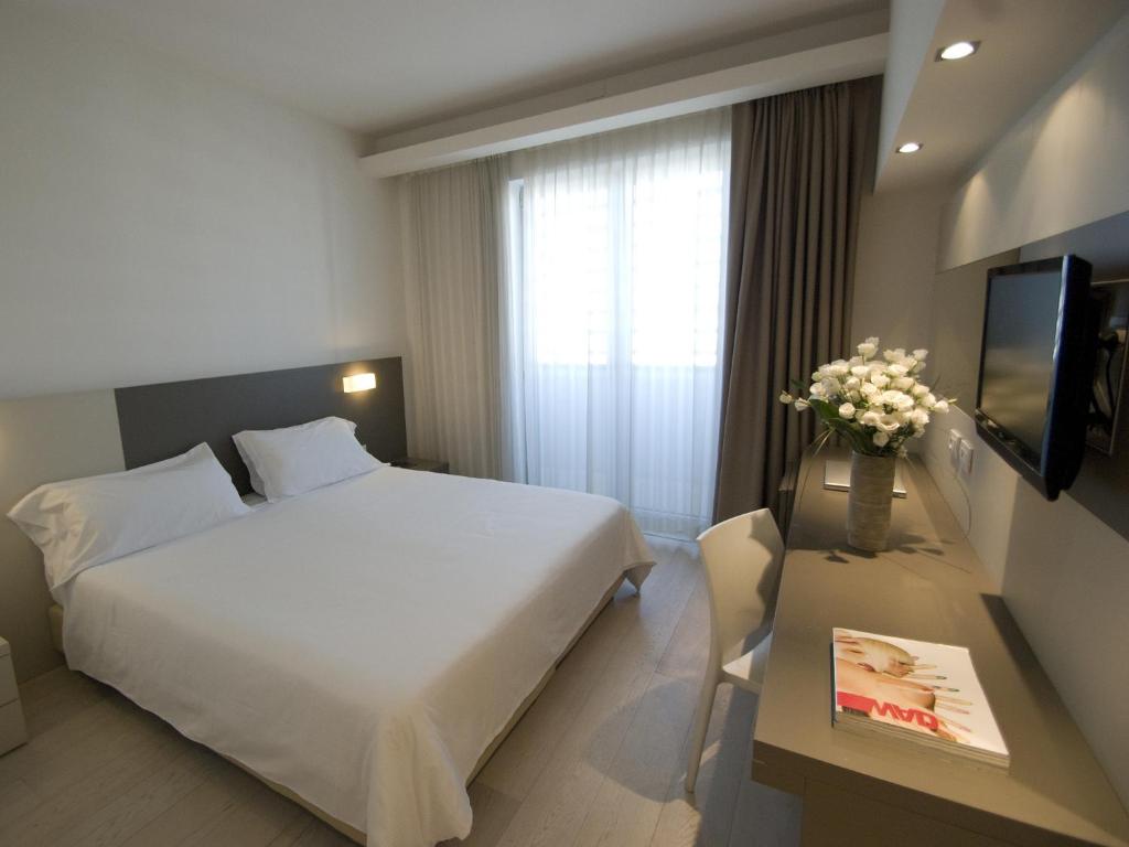 Postel nebo postele na pokoji v ubytování Hotel Cube