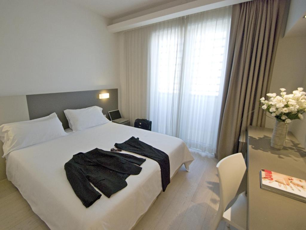 Postel nebo postele na pokoji v ubytování Hotel Cube