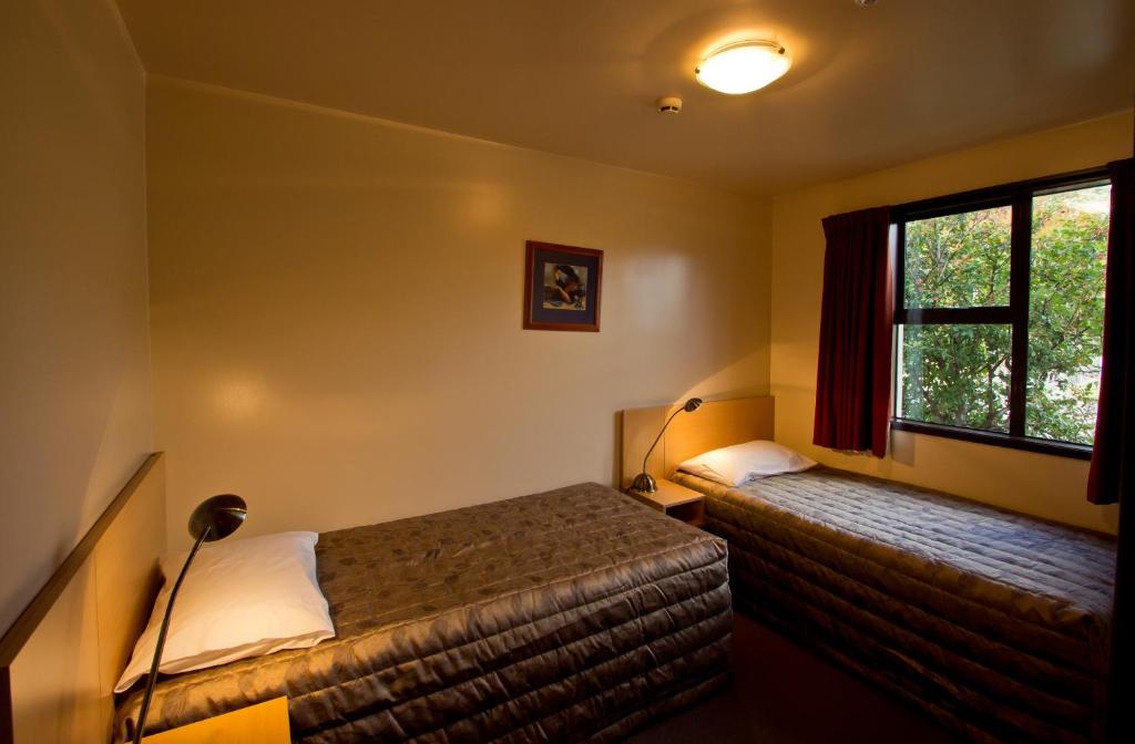 Postel nebo postele na pokoji v ubytování Broadway Motel