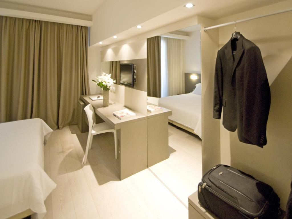 Postel nebo postele na pokoji v ubytování Hotel Cube