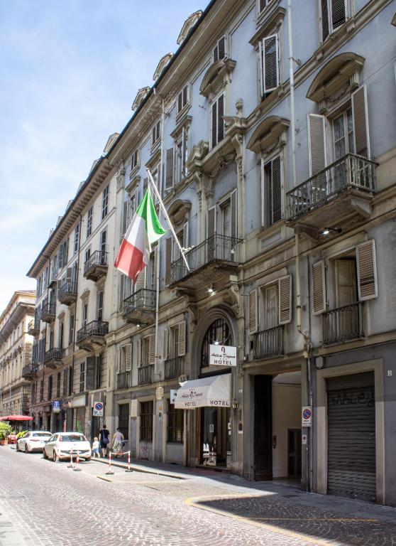a building with a flag on the side of it at Hotel Antica Dogana in Turin
