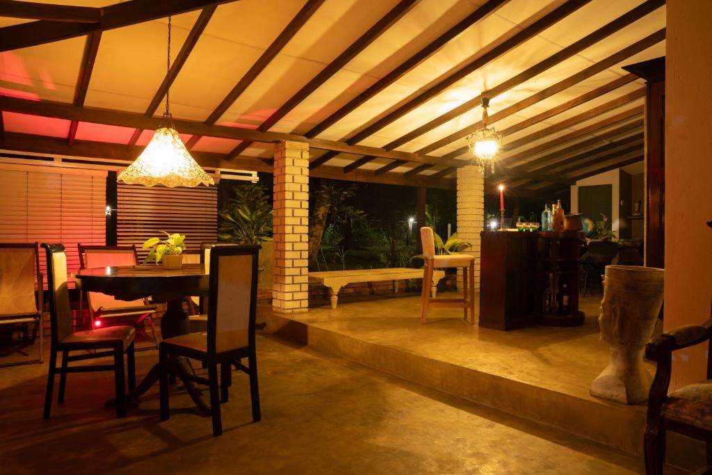 a patio with a table and chairs and a ceiling at Aviyan Villa Wadduwa in Wadduwa