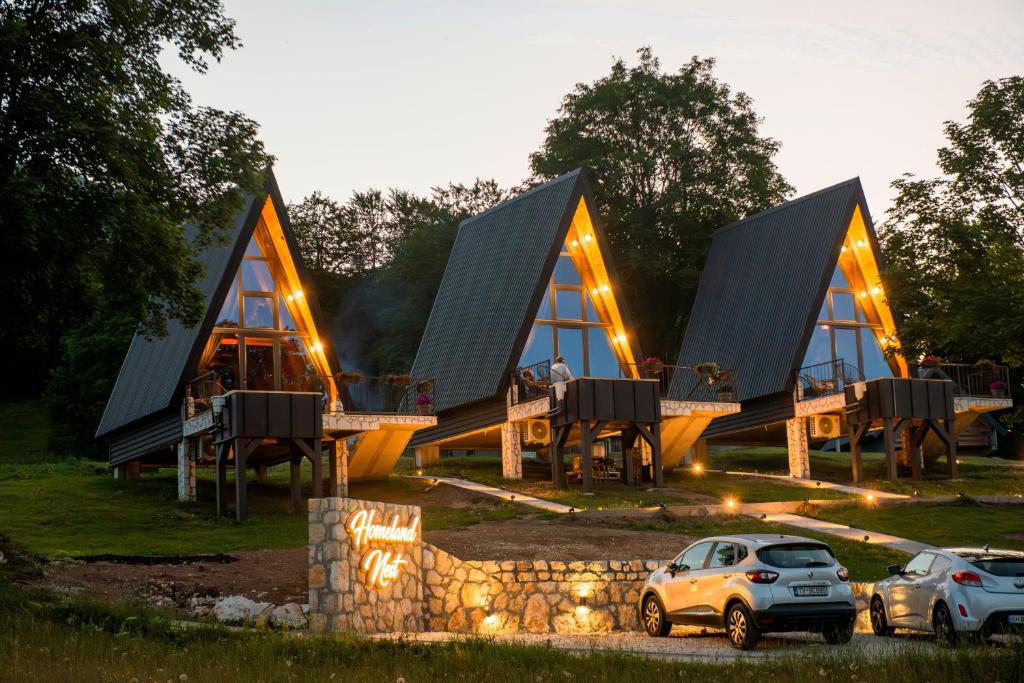 a house with a car parked in front of it at Homeland Nest in Žabljak