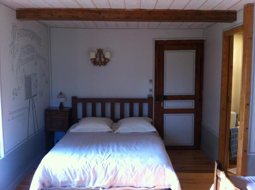 Postel nebo postele na pokoji v ubytování La Ferme Des Vignes