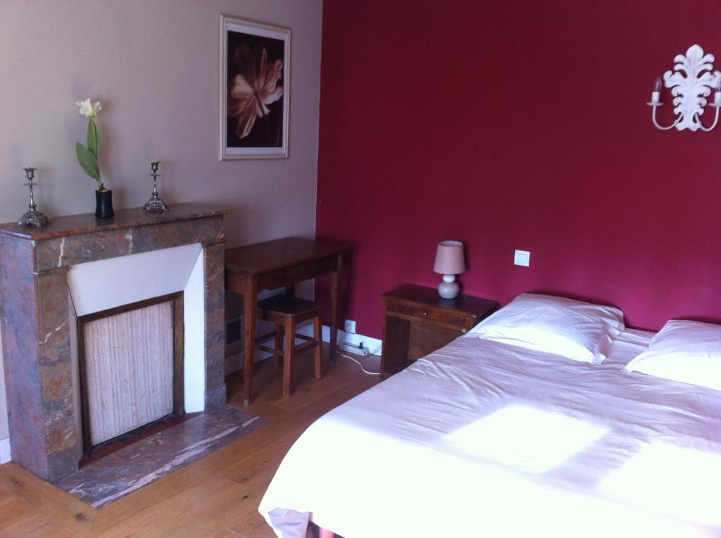 Postel nebo postele na pokoji v ubytování La Ferme Des Vignes