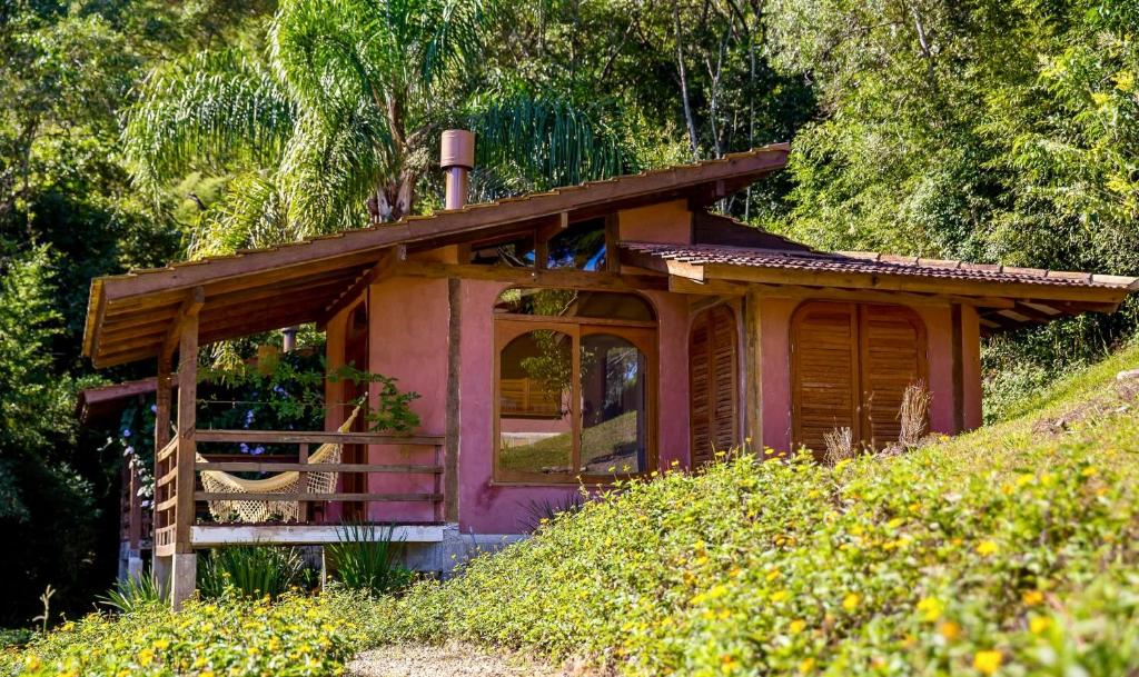a small house on the side of a hill at Pousada Ritmos da Terra - Estadia de 6ª a Domingo in Angelina