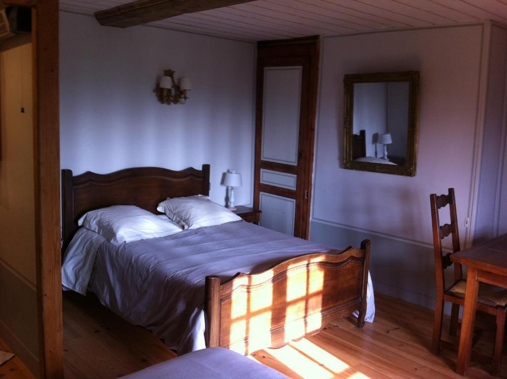 Postel nebo postele na pokoji v ubytování La Ferme Des Vignes