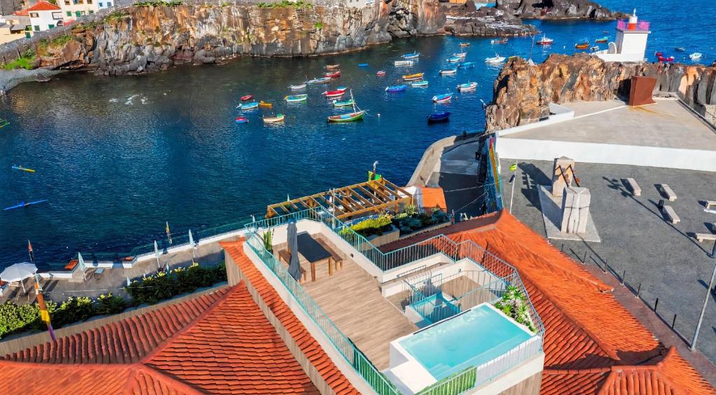 a view of a harbor with boats in the water at Villa Belafonte in Câmara de Lobos