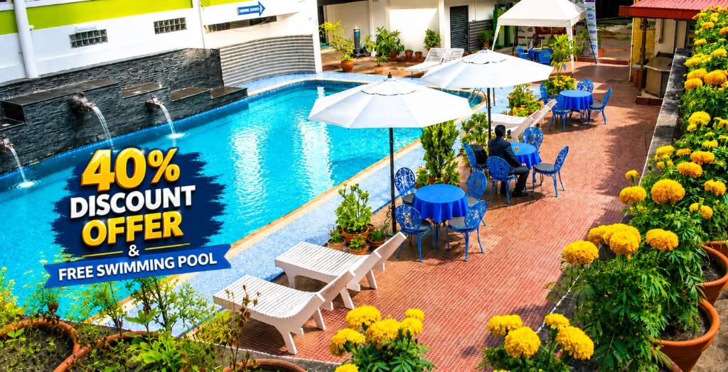 a sign that says discount offer at a resort swimming pool at Woodland Heritage Hotel in Kathmandu